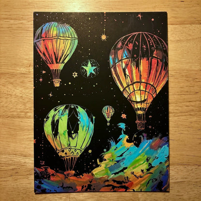 Completed A4 Glowing ScratchBoard with four hot air balloons and a starry night sky